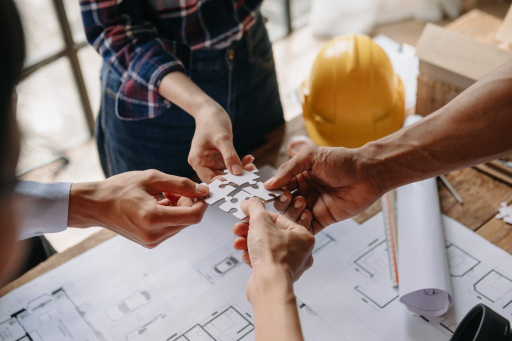 engineer-teamwork-meeting-drawing-working-on-blue